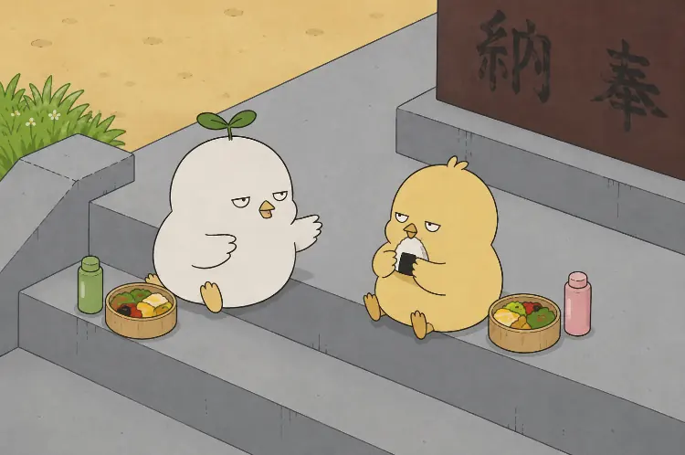 石段でお弁当を食べるふたり